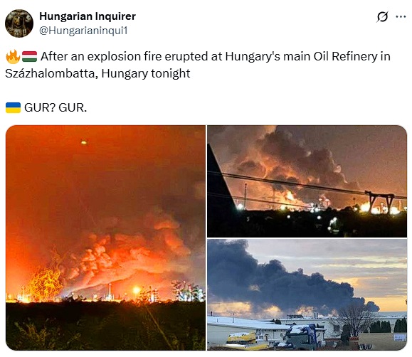 A large fire and smoke billowing from Hungary's main oil refinery in Százhalombatta, illuminated by flames under a night sky.