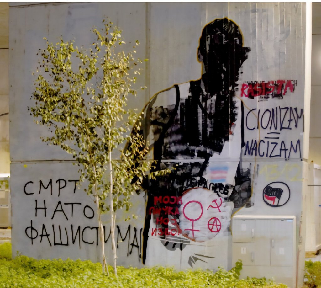 Charlie Kirk mural Belgrade Serbia defaced painted over