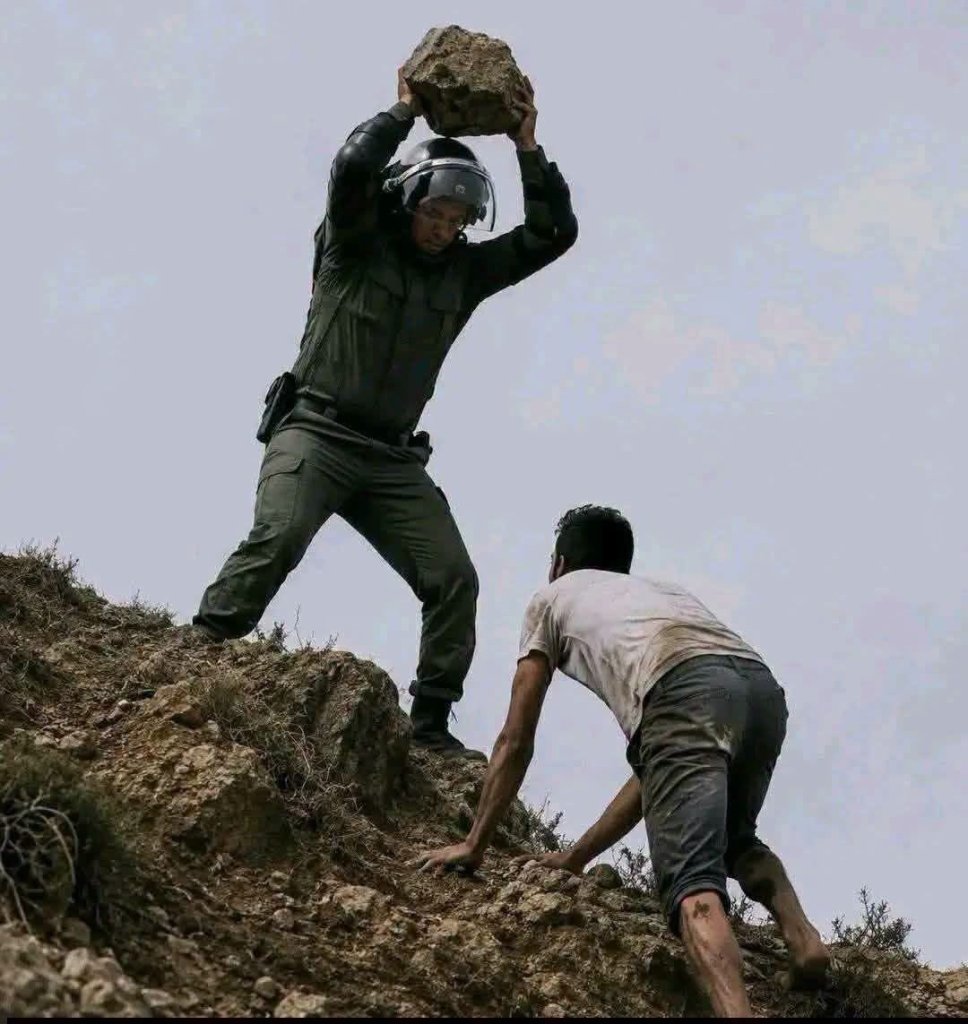 Ceuta migrant influx Morocco border guard stone attack on migrant